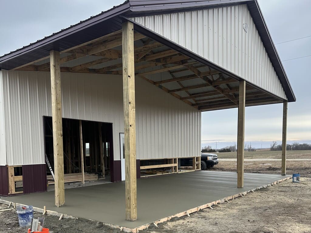 concrete shed with a freshly poured concrete slab